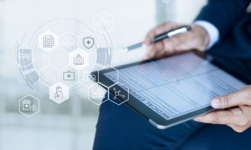 Health care insurance concept, Businessman completing a medical claim form with insurance icon health care on tablet digital.
